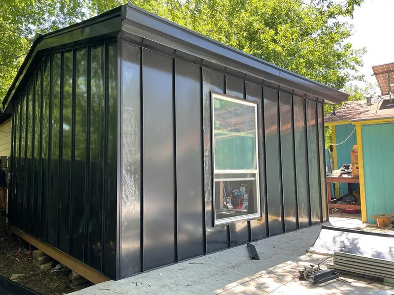 Black standing seam metal wall panels for Roof Inspection in Liberty Hill